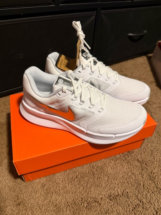 Nike Shoes - Nike Women's White Running Sneakers with Silver Metallic Swoosh.